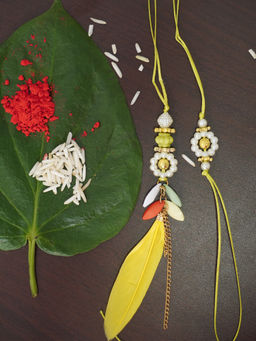 Niscka - Handcrafted Couple Rakhi with pearl work