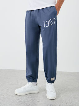 Styli - Blue Men Relaxed Fit Terry Jogger with Side Cord and Embroidery Detail