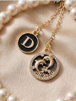 YELONA - Handmade Pearl and Bead Mobile Charm with Gold Dolphin Detailing