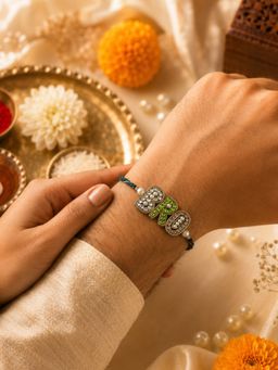 IKI CHIC - Crystal-Studded “BRO” Green Thread Rakhi