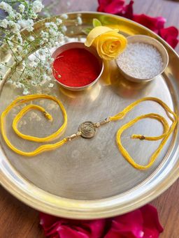 Studio Anviksha - Yellow Circular Spikes Brass Rakhi