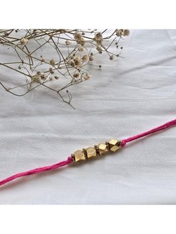 Studio Anviksha - Pink Beads Brass Rakhi