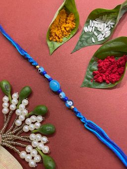 Digital Dress Room - Fancy Beautiful Designer Rakhi Blue Evil Eye Beads Criss Cross Thread Rakhi