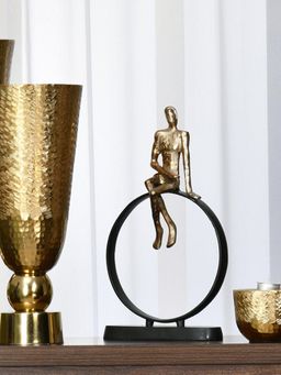 At Home by Nilkamal - Man Sitting On Cirque Decorative Metal Showpiece (Black & Gold)