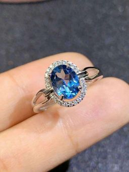 Jewels Galaxy - Silver Plated American Diamond Crushed Ice Cut Blue Oval Finger Ring