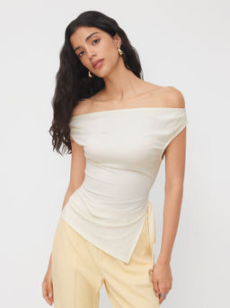 Cider - Off-shoulder Ruched Knotted Asymmetrical Hem Top