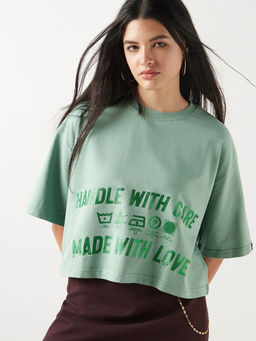 Bewakoof - Heavy Duty 1.0 Women's Granite green Handle with Care Graphic Printed Oversized Short Top