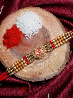 Shoshaa - Gold-Red Ethnic Om Thread Rakhi With Roli Chawal