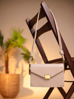 Twenty Dresses by Nykaa Fashion - Beige With Twisted Hearts Bag