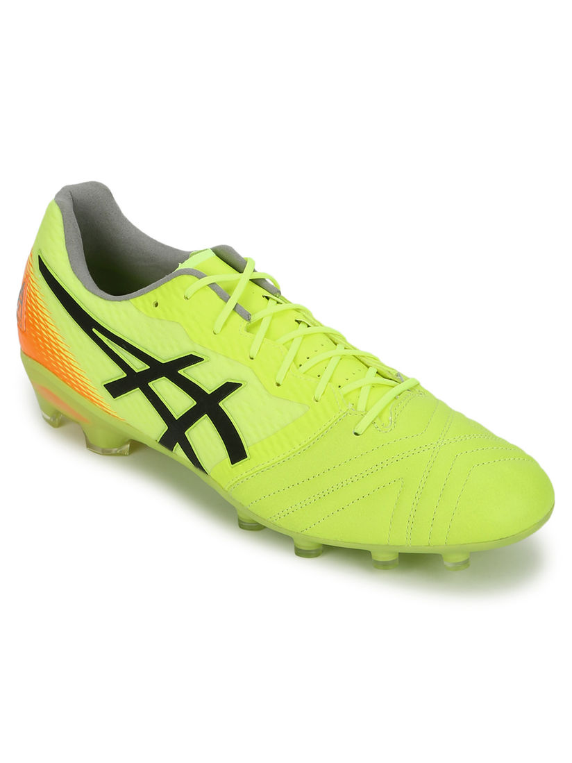 yellow asics boots