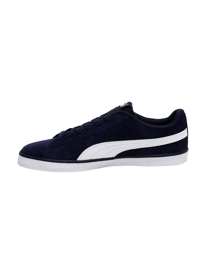 navy blue and white pumas