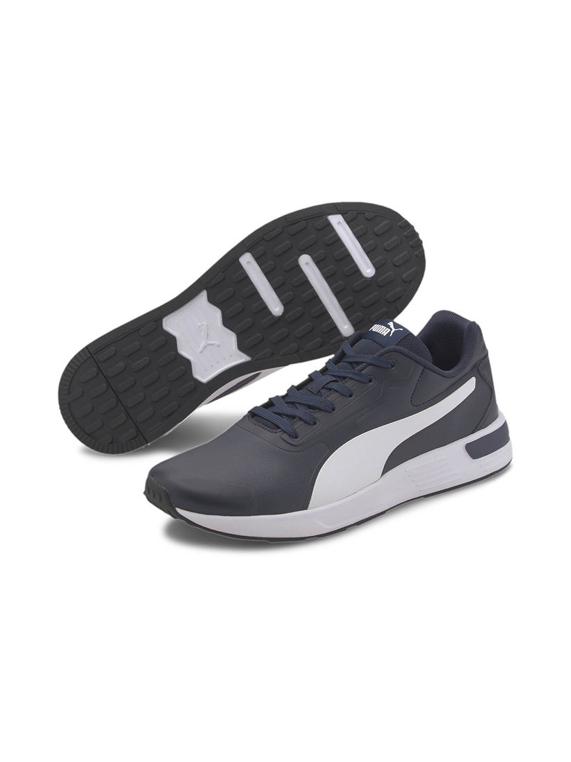 navy blue and white pumas