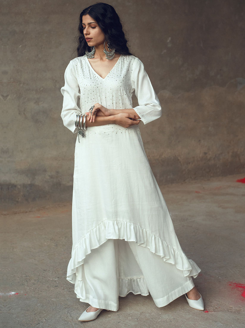 white ruffle flare pants